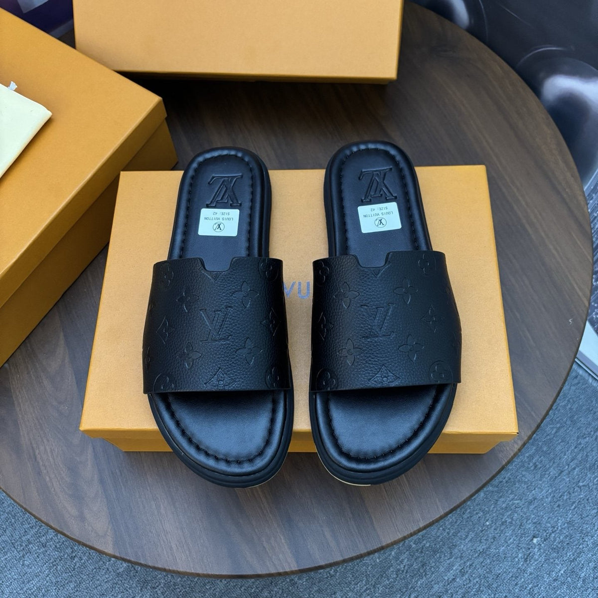 Louis Vuitton Black Embossed Strap Slide Sandals — hero